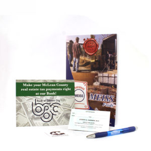 Examples of postcards, business cards, pens, and booklets that are printed by Pro-Type Printing